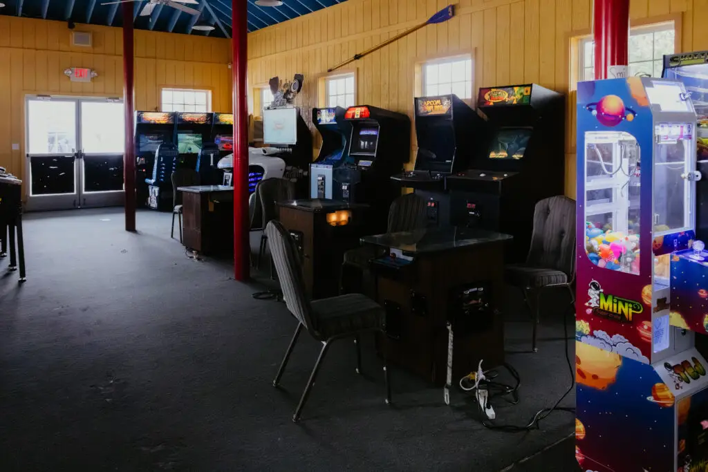 Wide view of the Buoy 18 arcade featuring classic arcade games, racing games, claw machines, and family entertainment in Bay City, Michigan.