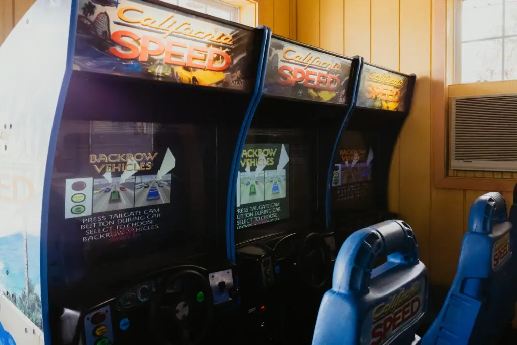 Players race side-by-side on California Speed arcade machines at Buoy 18 in Bay City, Michigan.