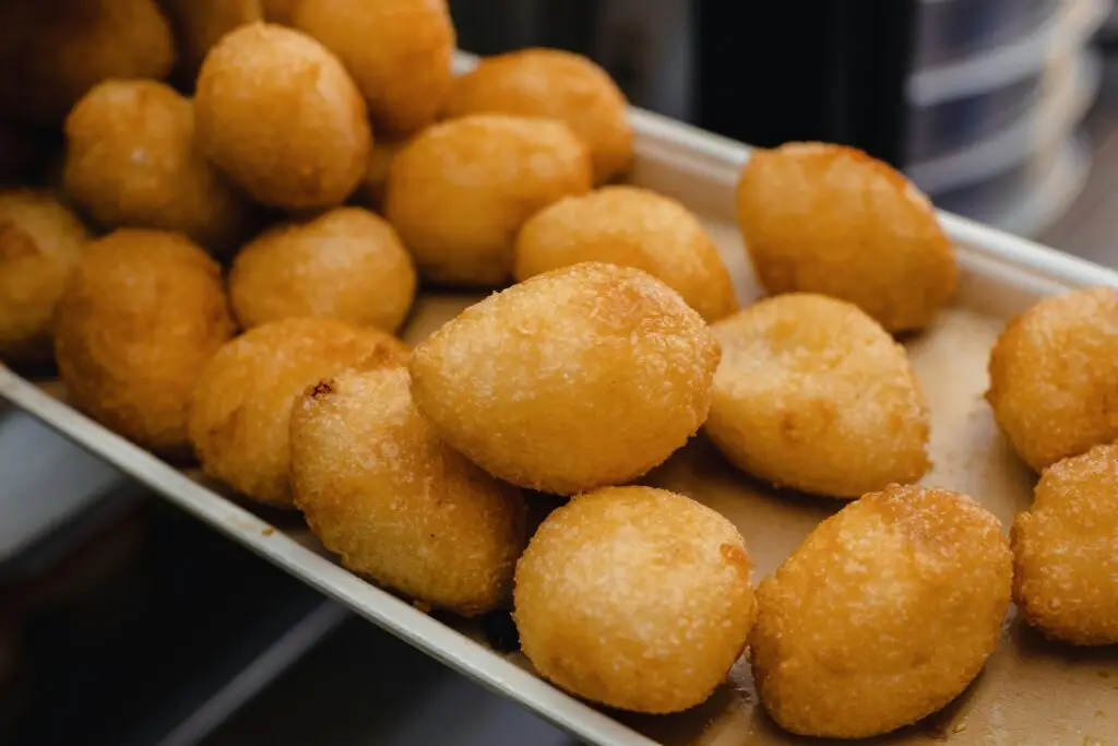 A tray of freshly cooked cheese curds coated in a light golden batter and ready to be served at Buoy 18.